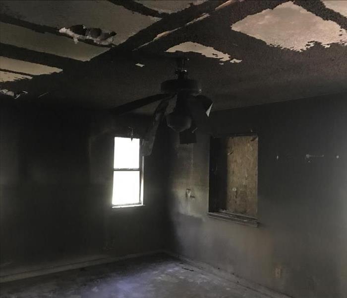 Room with severe fire damage.